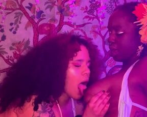 Latina and Ebony lesbian couple makeout and suck each other’s tits!